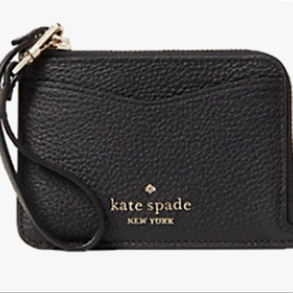 Used Kate Spade wristlet card holder, excellent condition.